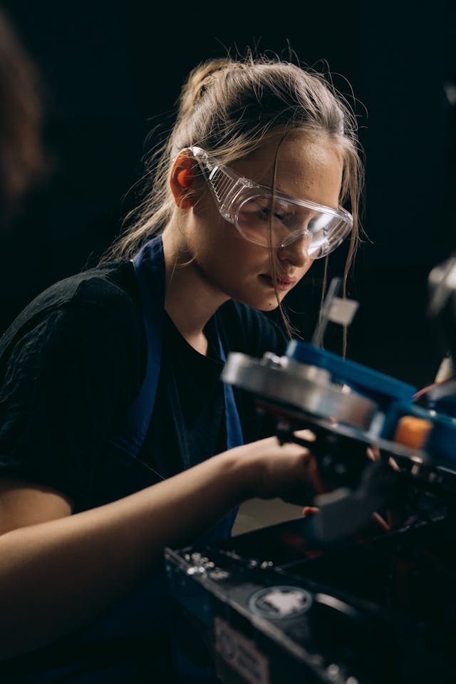 A young woman wearing safety glasses